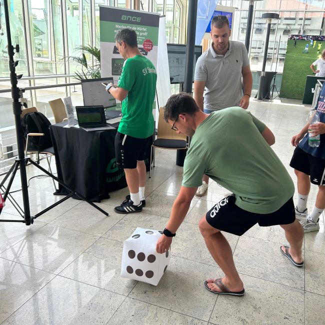 Roll-a-dice game at Once Sport booth